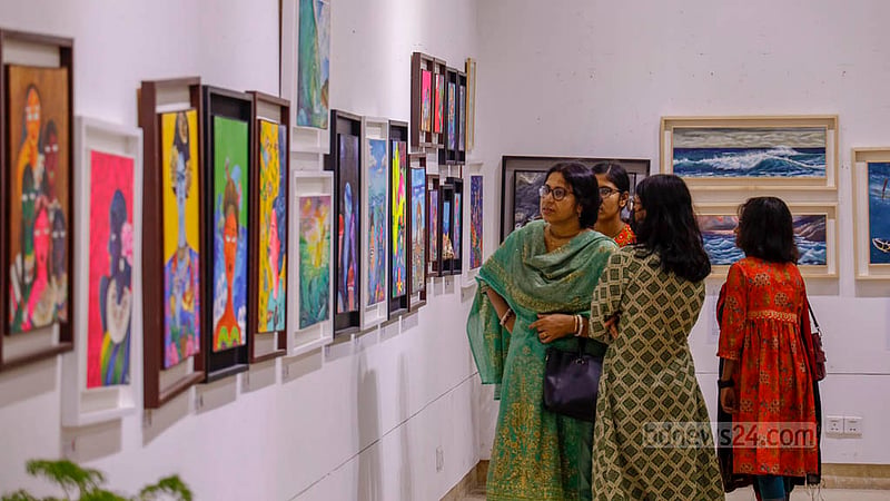 Visitors take a tour around the Exploring Art at Sea exhibition at Nalini Kanta Bhattasali Auditorium on Wednesday, Aug 2, 2023. Photo: Mahmud Zaman Ovi