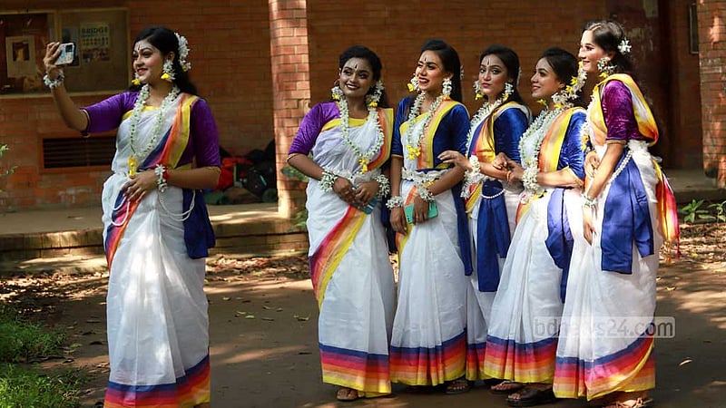 Women attend the Autumn Festival in a festive mood at Dhaka University’s Faculty of Fine Arts on Friday, Oct 13, 2023.