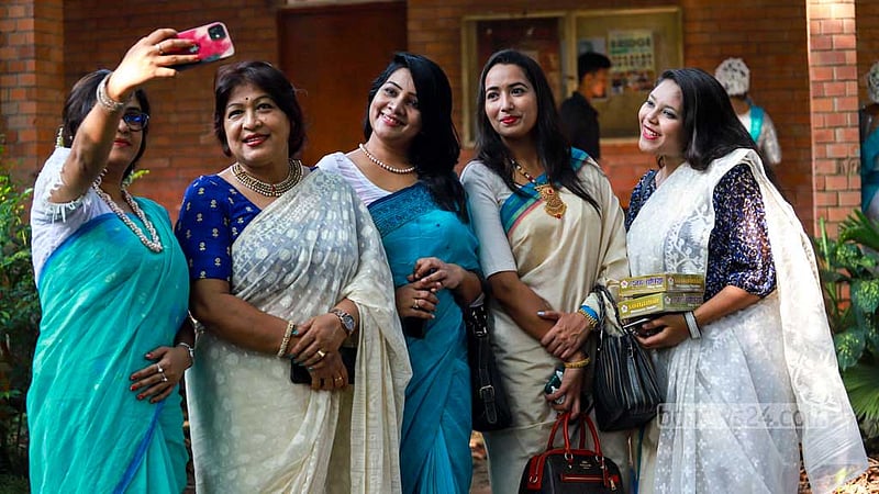 Women attend the Autumn Festival in a festive mood at Dhaka University’s Faculty of Fine Arts on Friday, Oct 13, 2023.