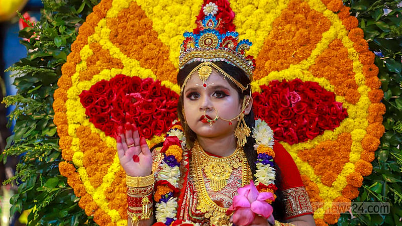 Shatakshi Goswami, a 5-year-old girl, is dressed up for being worshiped as part of Kumari Puja on the morning of Sharadiya Durga Puja’s Maha Ashtami at Ramakrishna Mission in Dhaka on Sunday, Oct 22, 2023. Photo: Tawhiduzzaman Tapu