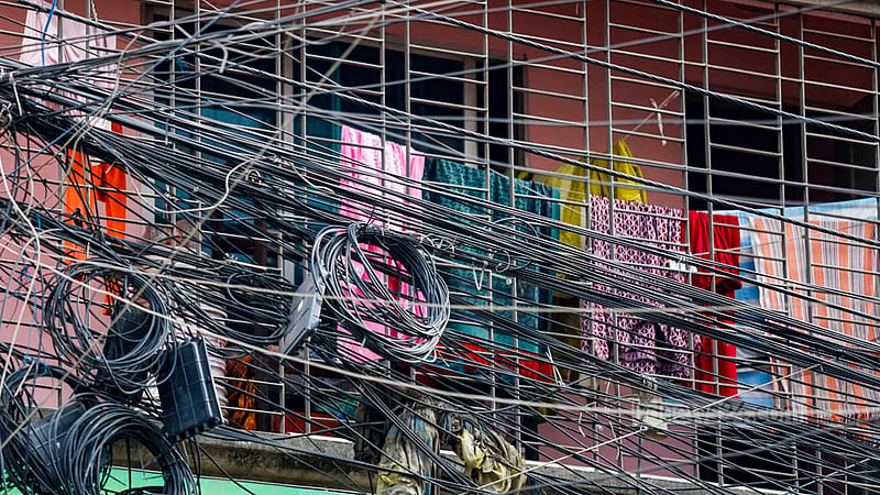 Internet and satellite cables have covered the front of the second floor of a building in Dhaka’s South Banasree. Photo: Mahmud Zaman Ovi