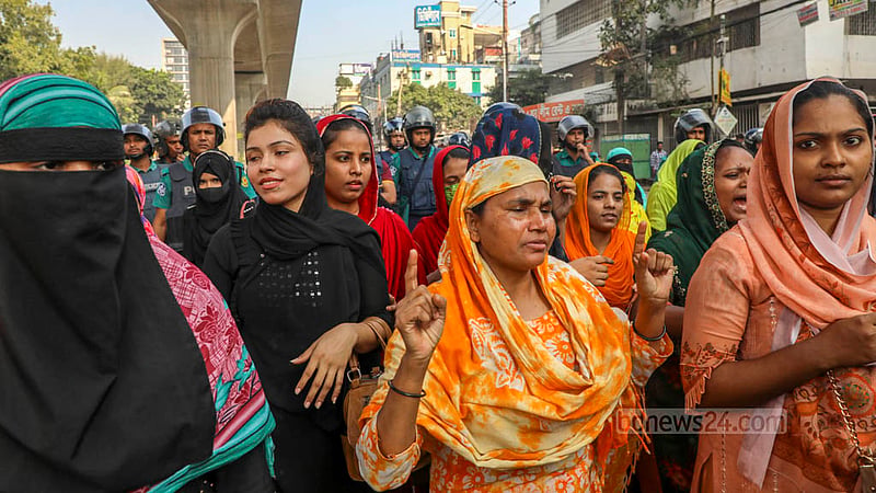 Readymade garments workers block the road to protest for a wage hike in Dhaka’s Mirpur on Sunday, Nov 12, 2023.