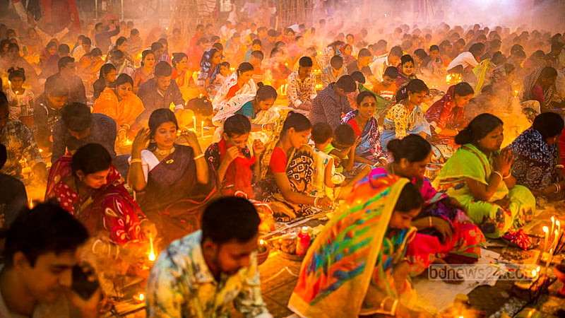 Disciples of Baba Lokenath Brahmachari pray during Rakher Upobash or Kartik Broto festival at Barodi Lokenath Ashram in Narayanganj on Saturday, Nov 11, 2023.