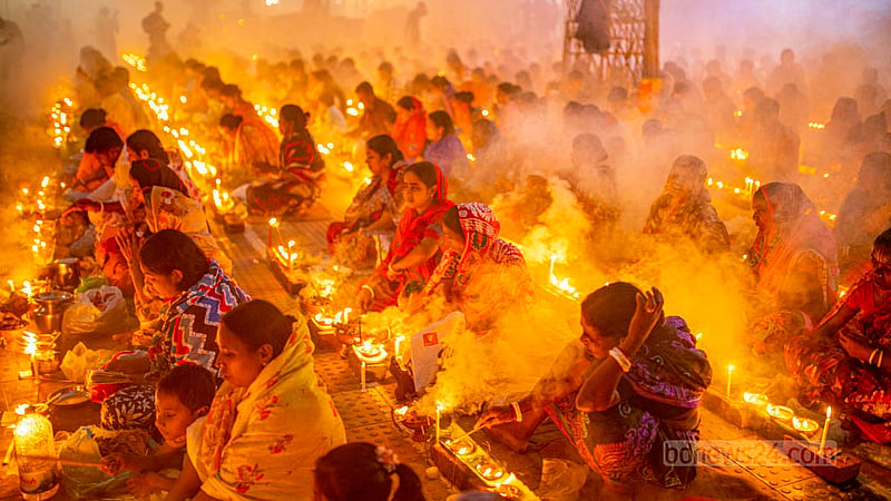 Disciples of Baba Lokenath Brahmachari pray during Rakher Upobash or Kartik Broto festival at Barodi Lokenath Ashram in Narayanganj on Saturday, Nov 11, 2023.