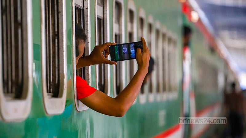 People take selfies with the Sundarban Express train, which crossed the Padma Bridge Rail Link  as the first train, heading towards Khulna from Dhaka on Thuesday, Nov 2, 2023. Photo: Tawhiduzzaman Tapu