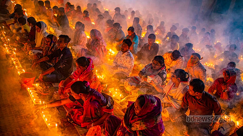 Disciples of Baba Lokenath Brahmachari pray during Rakher Upobash or Kartik Broto festival at Barodi Lokenath Ashram in Narayanganj on Saturday, Nov 11, 2023.