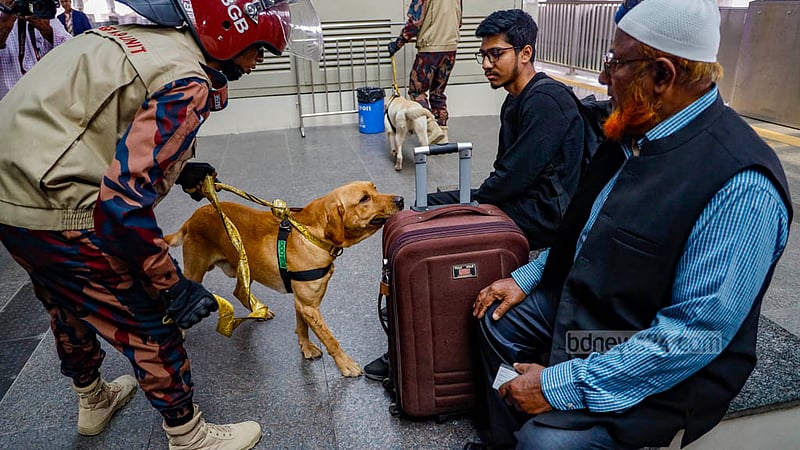 BGB’s dog squad searches passengers at Agargaon Metro Rail Station in Dhaka on Sunday, Dec 31, 2023, ahead of the Jan 7 general election.