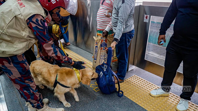 BGB’s dog squad searches passengers at Agargaon Metro Rail Station in Dhaka on Sunday, Dec 31, 2023, ahead of the Jan 7 general election.