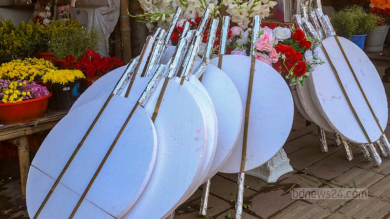 Florists line up cork sheets outside the flower shops to put their floral arrangements on display.