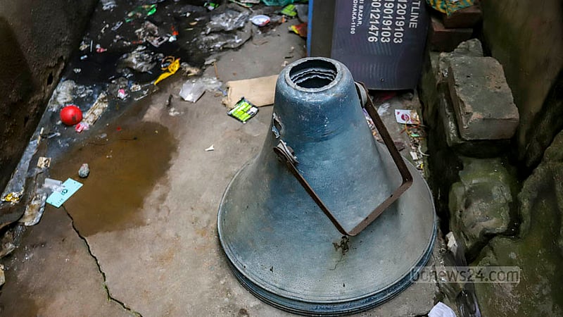 The owner of a shop renting out loudspeakers in Dhaka’s Shakharibazar opts against repairing old equipment due to a lack of demand.