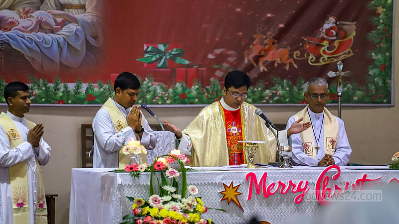 A priest takes part in a Christmas prayer service at the Holy Rosary Church in Dhaka’s Tejgaon on Monday, Dec 25, 2023.