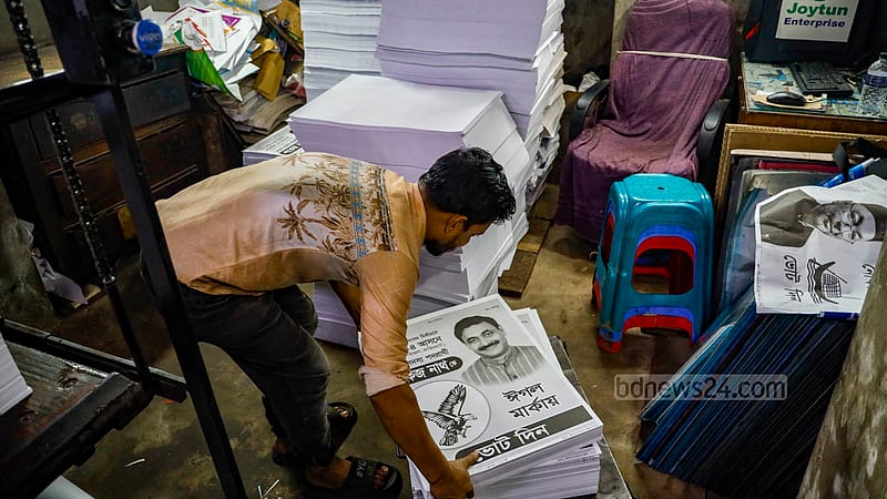 A worker prepares to print a campaign poster in Old Dhaka’s Zindabahar area on Dec 21, 2023, ahead of the 12th national parliament election.
