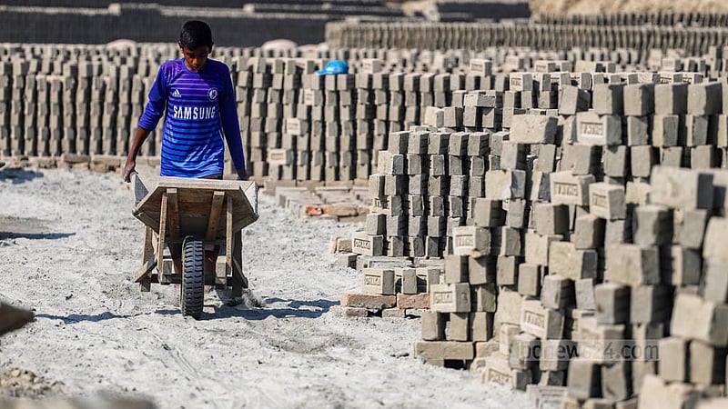 A child works in a brick kiln near the Buriganga River, even though child labour in hazardous jobs is prohibited.  Photo: Tawhiduzzaman Tapu