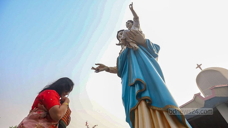A woman takes part in a Christmas prayer service at the Holy Rosary Church in Dhaka’s Tejgaon on Monday, Dec 25, 2023.