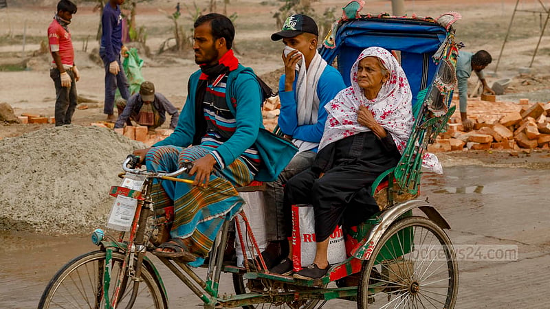 There is no alternative to using masks or covering faces with hands to ward off the dust whenever a bus or truck arrives in the Gabtoli section of the road to Sadarghat in Dhaka.