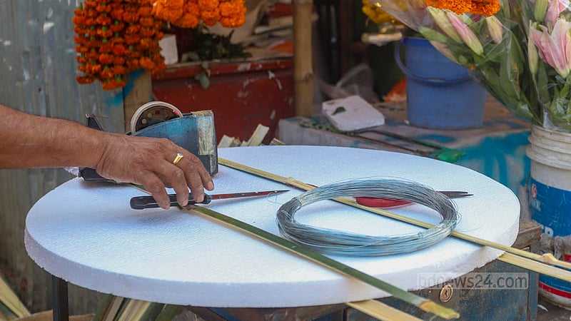 Wholesale florists in Dhaka's Agargaon area are putting their floral arrangements on display. Cork sheet traders also get busy as local florists purchase more sheets ahead of Victory Day.