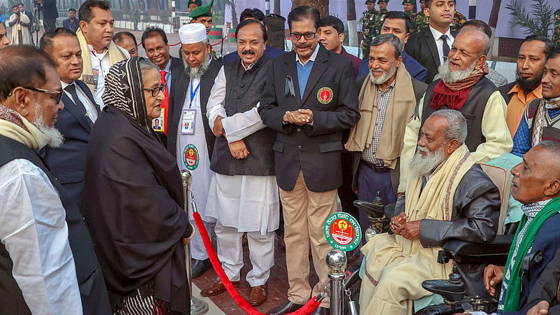 Prime Minister Sheikh Hasina exchanges greetings with freedom fighters after paying homage to the nation's sharpest minds at the Martyred Intellectuals’ Memorial in Dhaka’s Mirpur on Thursday, Dec 14, 2023.