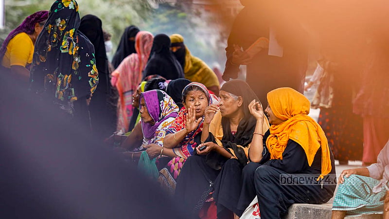 Most of the people waiting for the arrival of a TCB truck are women at Hatijheel’s Madhubagh section.
