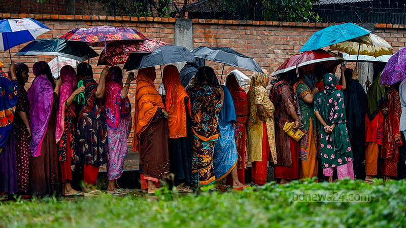 Some women wait for hours in the rain for a TCB truck so they can buy goods at subsidised prices at Hatirjheel’s Madhubagh section.
