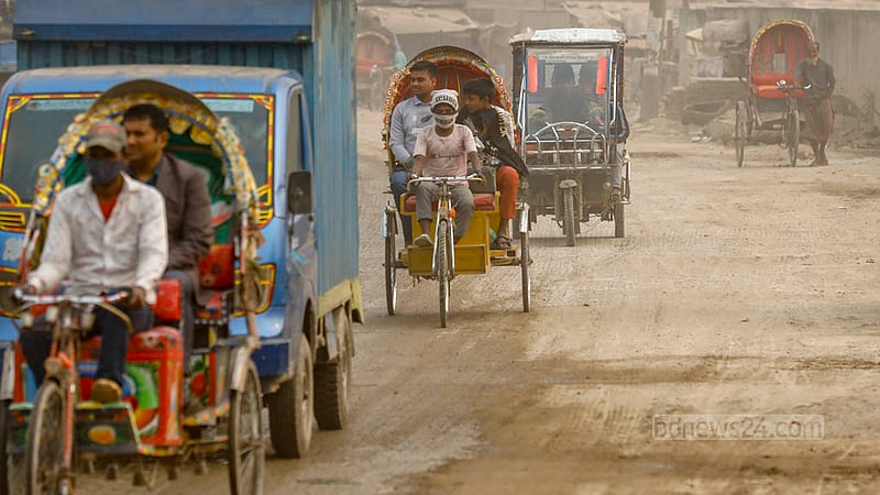 There is no alternative to using masks or covering faces with hands to ward off the dust whenever a bus or truck arrives in the Gabtoli section of the road to Sadarghat in Dhaka.
