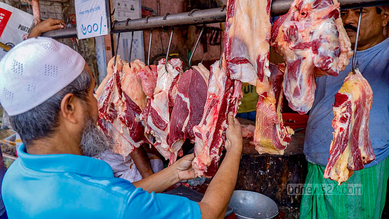 A customer buys beef at Sipahibagh bazar in Khilgaon on Monday, Dec 4, 2023.