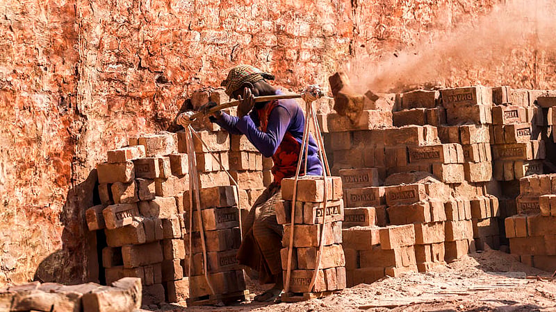 Labourers work in a brick kiln without safety gear near the Buriganga River in Dhaka’s Basila. Photo: Tawhiduzzaman Tapu