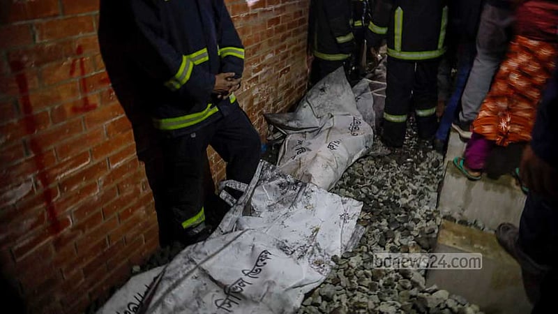 The bodies of the victims of an arson attack on Benapole Express train in Dhaka on Friday night, Jan 5, 2024.