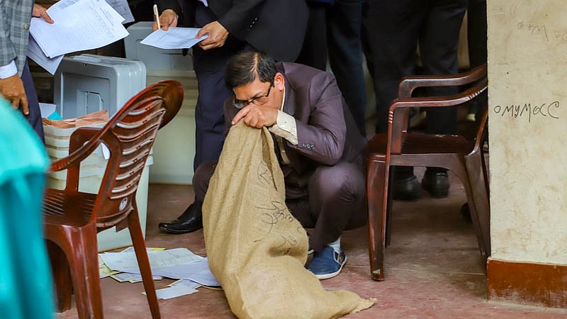 The presiding officer receives the voting materials for the Dhaka-8 seat from Willes Little Flower School and College on Saturday, Jan 6, 2024.