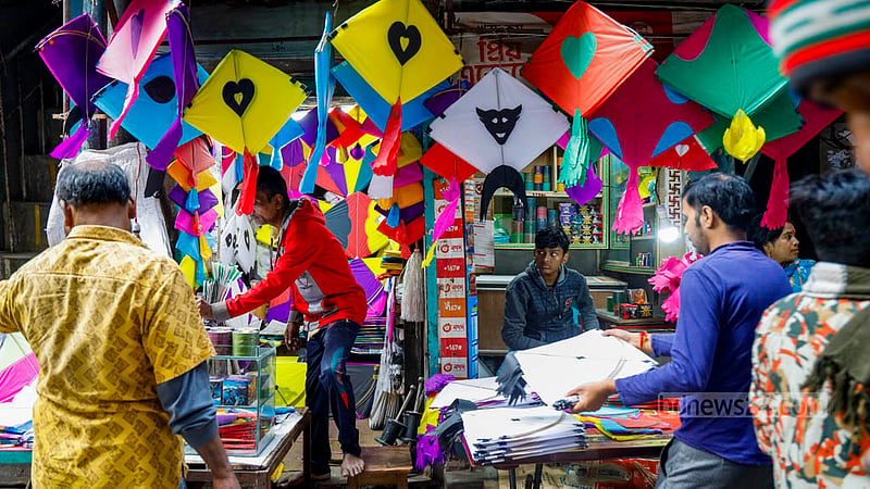 On the eve of Shakrain, an array of brightly coloured kites flutter through the shops of Old Dhaka's Shankharibazar.