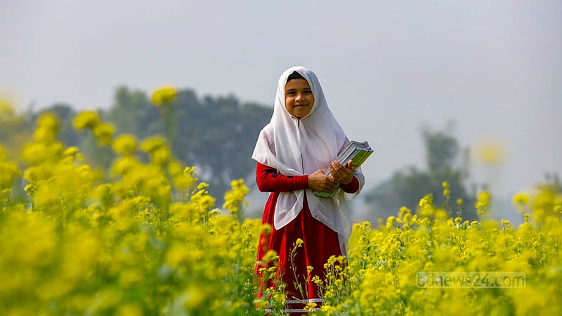 Sheikh Suraiya, a third grader at Raydakkhin Government Primary School in Manikganj’s Singair Upazila, is happy to get new textbooks.