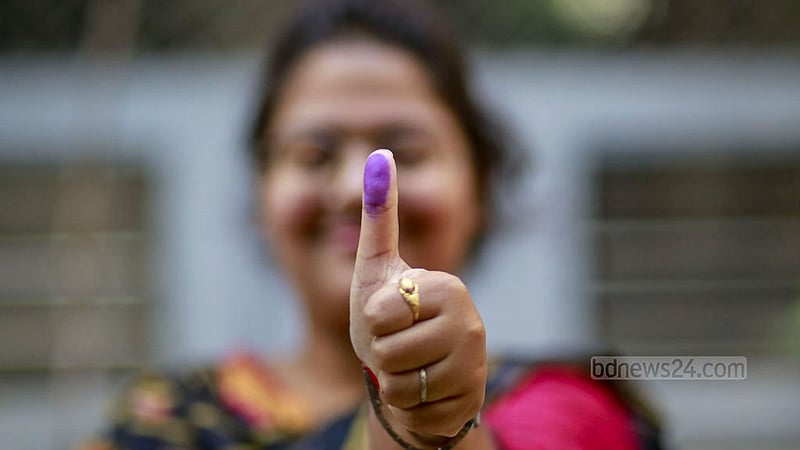 A first-time voter shows off the permanent ink used to colour her finger after casting her ballot at the Habibullah Bahar College polling centre in Dhaka’s Shantinagar on Sunday, Jan 7, 2024, the day of the 12th national parliamentary elections.