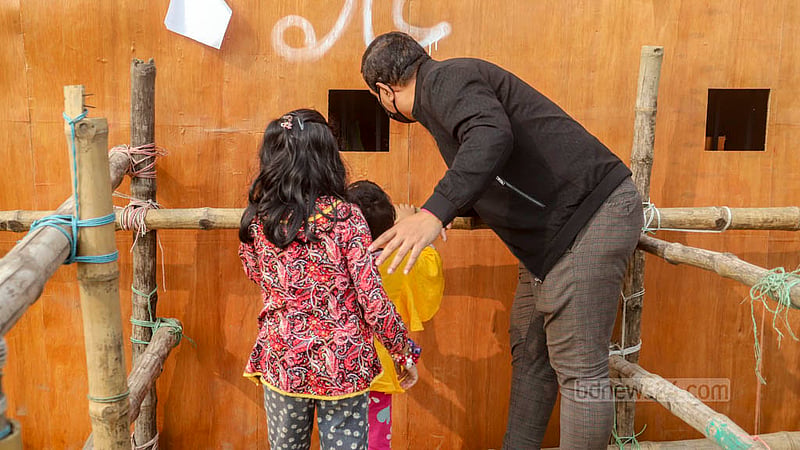 Visitors collect tickets from the Dhaka International Trade Fair counter on Friday, Jan 26, 2024.