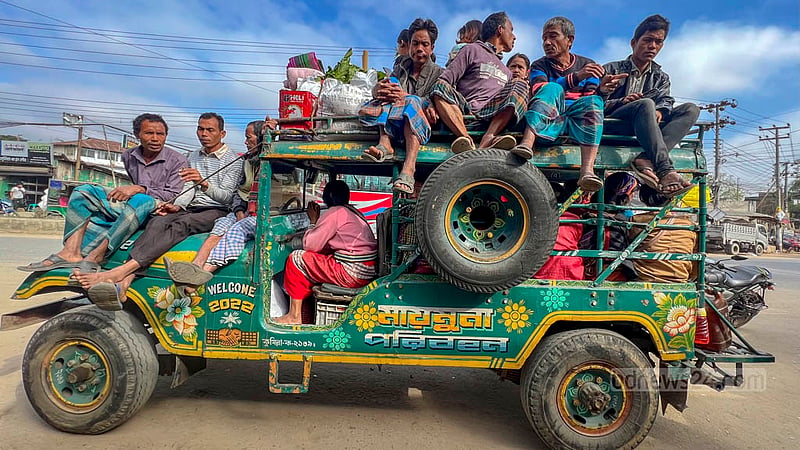 Passengers climb onto the roofs of Chander Gari vehicles to travel. Some sit on top with their legs dangling off, while others can even be seen sitting on the bonnets of the vehicles.