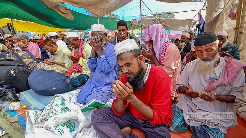 Followers of Tabligh Jamaat take part in the Akheri Munajat to close out the second phase of the Bishwa Ijtema on the banks of the Turag River in Tongi on Sunday, Feb 11, 2024.