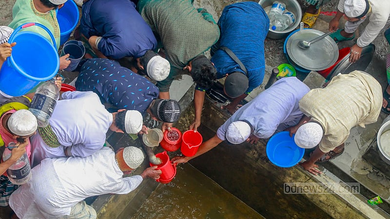 People rush to perform wudu or ablution due to concerns about a water shortage at the Ijtema premises before Jumma prayers on Friday, Feb 2, 2024.