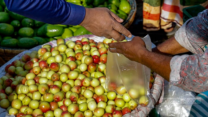 In Dhaka's Karwan Bazar, traders use polythene bags to package plums for sale.