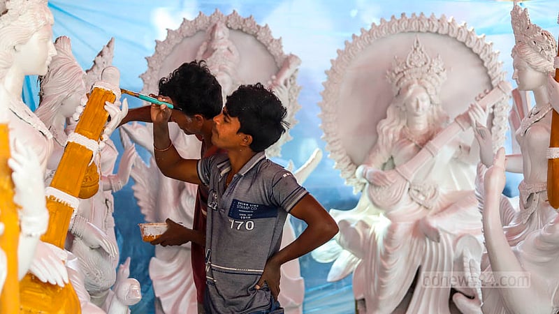 Artisans with brushes and paint give final touches to idols of Saraswati, the Hindu goddess of wisdom and learning, at Dhaka University’s Jagannath Hall.