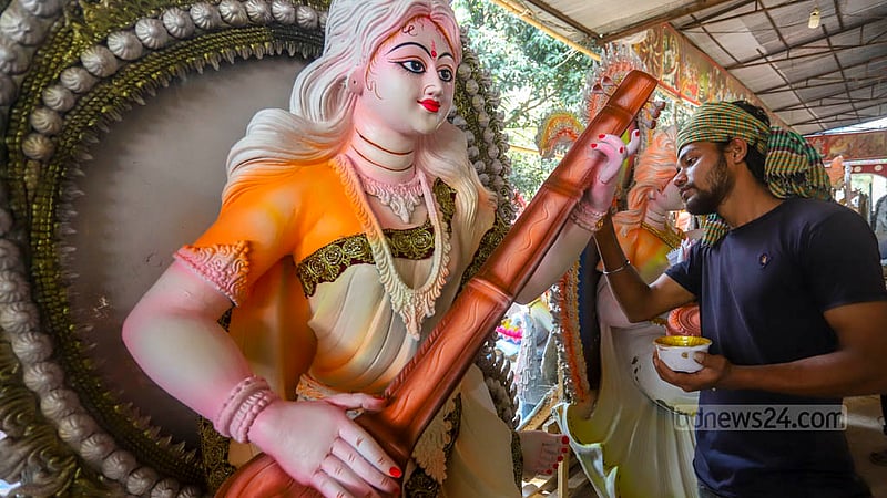 Artisans paint idols of Saraswati, the Hindu goddess of wisdom and learning, at Ramna Kali Temple for different departments of Dhaka University.