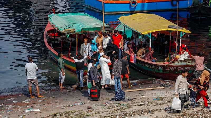 Passengers get off a boat at Hasnabad Boro Jame Mosque jetty below the Postogola Bridge, which is closed for repair works.