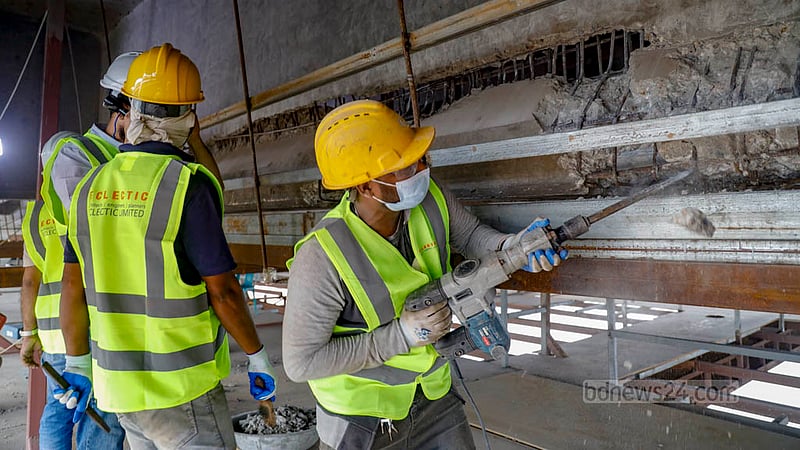 Repair work is under way on the girders of the Postogola Bridge damaged by the rescue vessel Pratyaya.