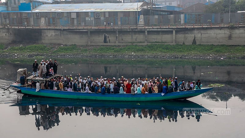An engine-run boat carries Muslims to the Ijtema grounds on the banks of the Turag River in Tongi.