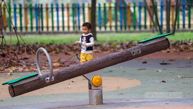 The seesaw in the Children's Corner of Dhaka's Ramna Park is missing a handle on one side, making it risky for children to use.
