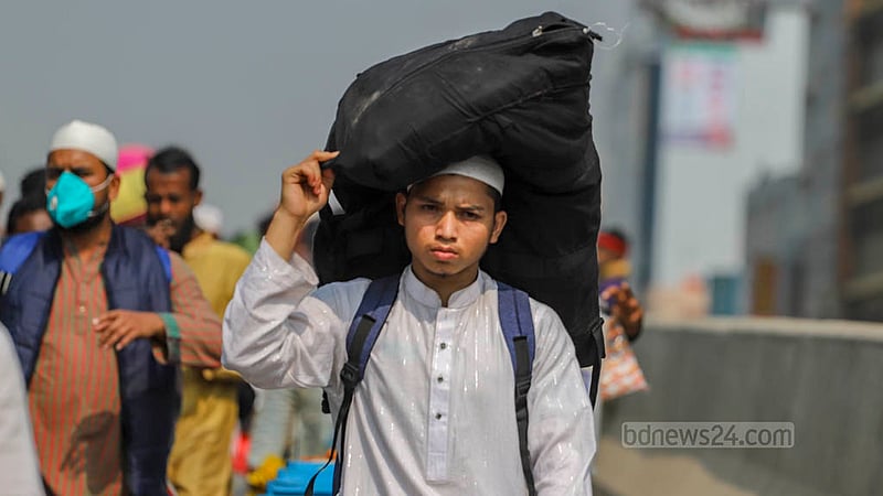 A young man, a bag perched atop his head, joined the throngs walking back from the event's venue on the outskirts of Dhaka on Sunday, Feb 4, 2024.