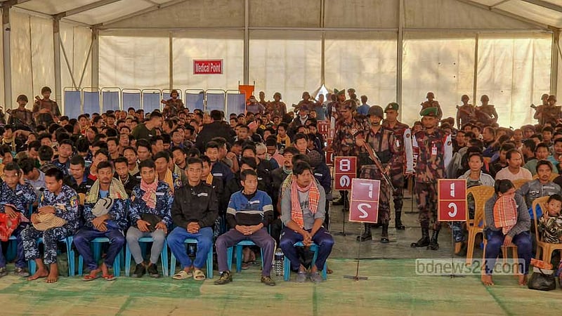 BGP personnel who fled Myanmar due to the ongoing conflict between the Arakan Army and the military junta forces wait in tents before boarding a homebound ship from Ukhiya's Inani coast in Cox's Bazar on Thursday.