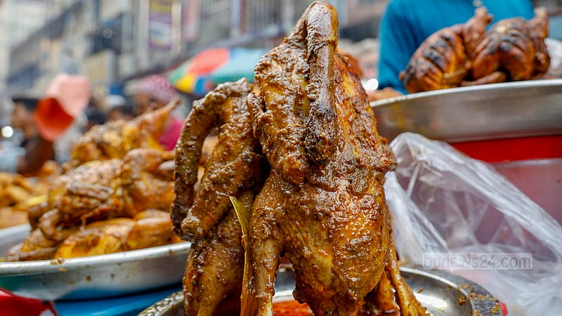 Greased with spices, whole chickens are a highlight for Iftar in Old Dhaka’s Chawkbazar.