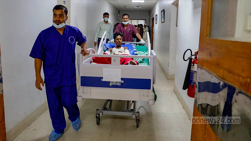 Munnaf, 18, suffered burns on 40 percent of his body in the gas cylinder explosion in Gazipur's Kaliakair. On Thursday, he was moved for dressing procedures from the post-operative care room at the Sheikh Hasina National Institute of Burn and Plastic Surgery.