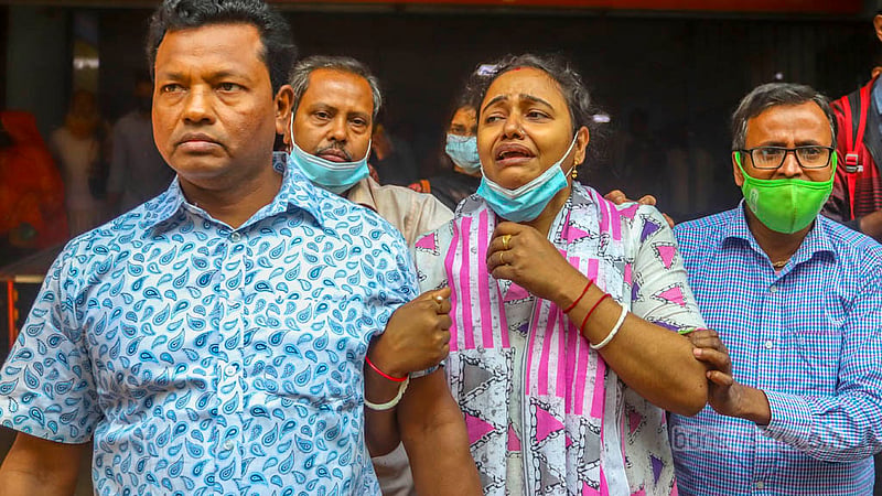 Grief-stricken family members wait to receive the body of journalist Tushar Hawladar at Dhaka Medical College Hospital on Friday, Mar 1, 2024, a day after his death in the Bailey Road building fire.