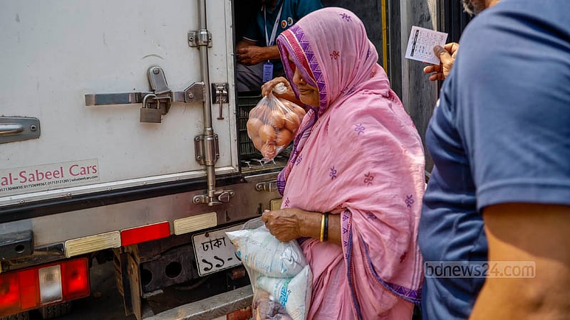 A woman buys necessities from a mobile food truck funded by the Ministry of Fisheries and Livestock on Wednesday, Mar 13, 2024.