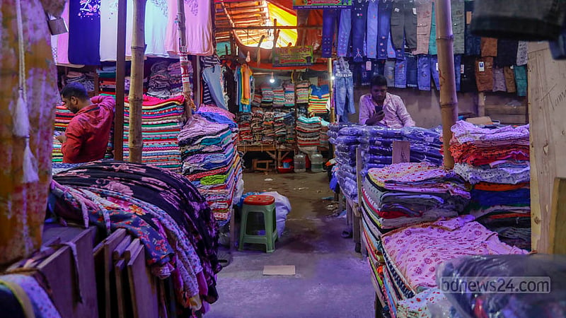 Traders at Bangabazar wait for customers before Eid, but few are to be found.