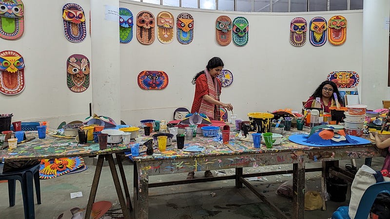 Artists work on masks for the Mangal Shobhajatra procession at the Dhaka University Faculty of Fine Art.